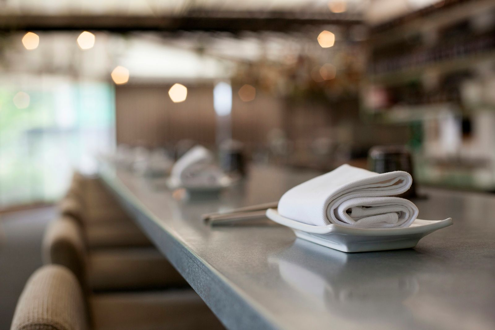 Clean white restaurant linen on a fine dining counter